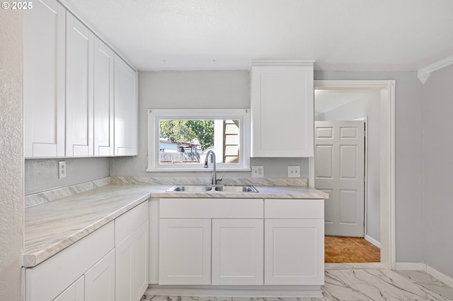 32791 E Lincoln Way, Coburg, OR 97408 - kitchen with a sink, white cabinetry, light countertops, and baseboards