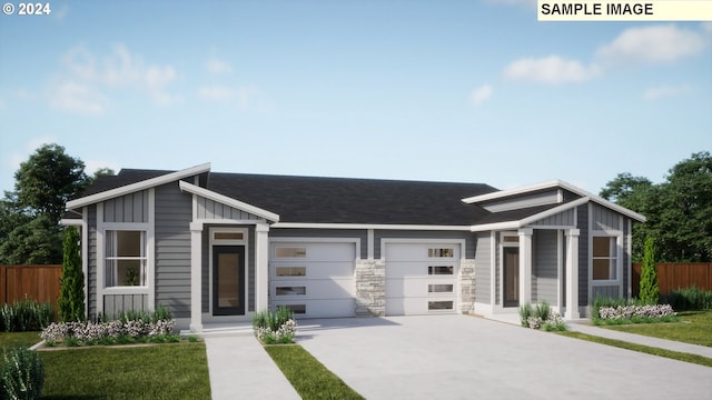 view of front facade with a shingled roof, concrete driveway, board and batten siding, fence, and a garage