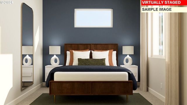 bedroom featuring baseboards and carpet