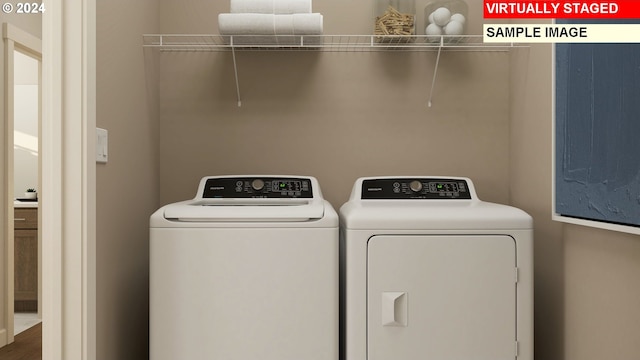clothes washing area with laundry area and independent washer and dryer
