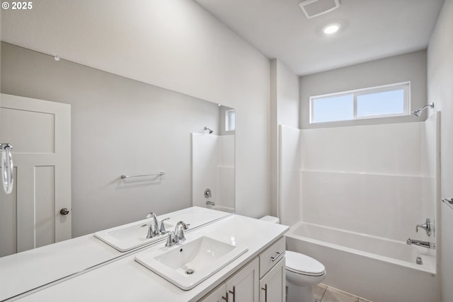bathroom with tile patterned flooring, visible vents, toilet, bathtub / shower combination, and vanity