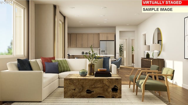 living room with light wood finished floors and a wealth of natural light