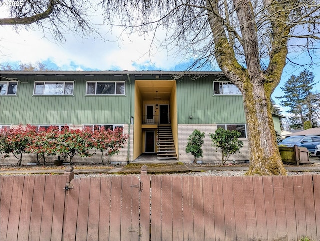 13155 SW Allen Blvd Unit 11, Beaverton, OR 97005 - raised ranch featuring brick siding, stairway, and fence