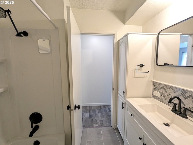 13155 SW Allen Blvd Unit 11, Beaverton, OR 97005 - full bath featuring a textured ceiling, backsplash, vanity, and washtub / shower combination