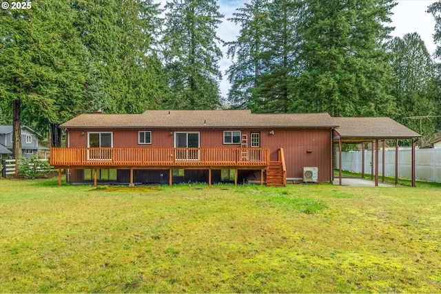 rear view of house featuring a lawn, ac unit, and a deck