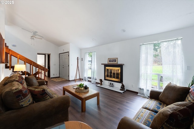 living room featuring dark wood-type flooring and lofted ceiling