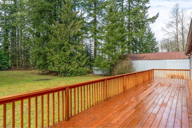 wooden terrace with a lawn