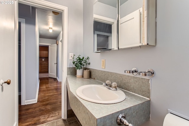 bathroom featuring vanity and wood finished floors