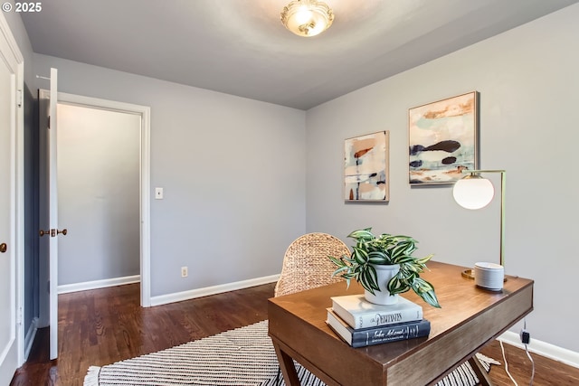 home office with baseboards and wood finished floors