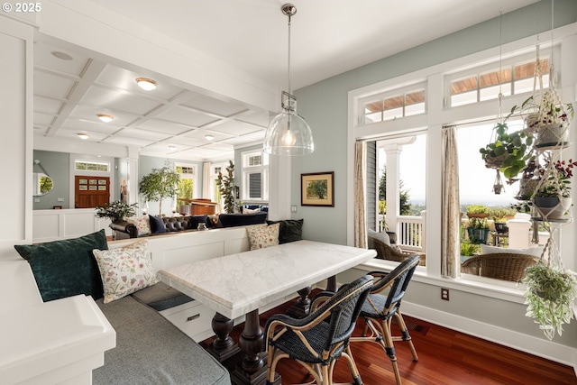 9309 NW Murdock St, Portland, OR 97229 - dining area featuring dark wood-type flooring, coffered ceiling, decorative columns, beamed ceiling, and baseboards