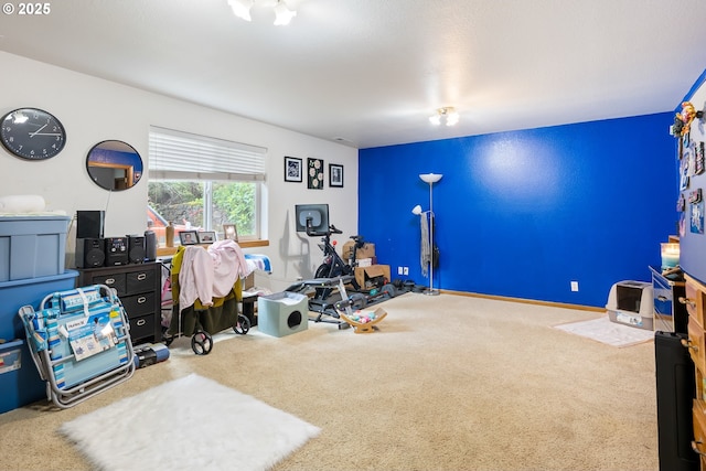 exercise room with carpet flooring