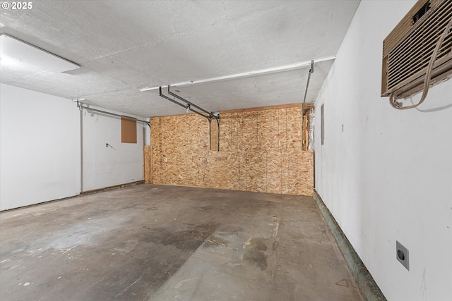2509 E J Ct, La Grande, OR 97850 - basement with a garage and a wall mounted AC