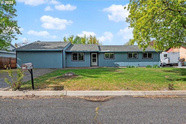 2509 E J Ct, La Grande, OR 97850 - ranch-style home with a front lawn and fence