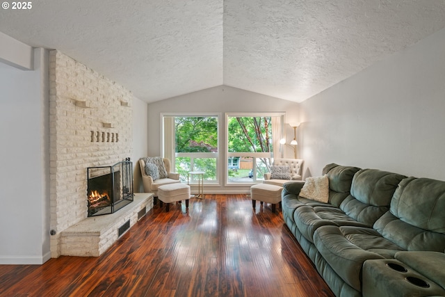 790 SE Robin Way, Gresham, OR 97080 - living room with hardwood / wood-style floors, vaulted ceiling, a textured ceiling, a fireplace, and baseboards