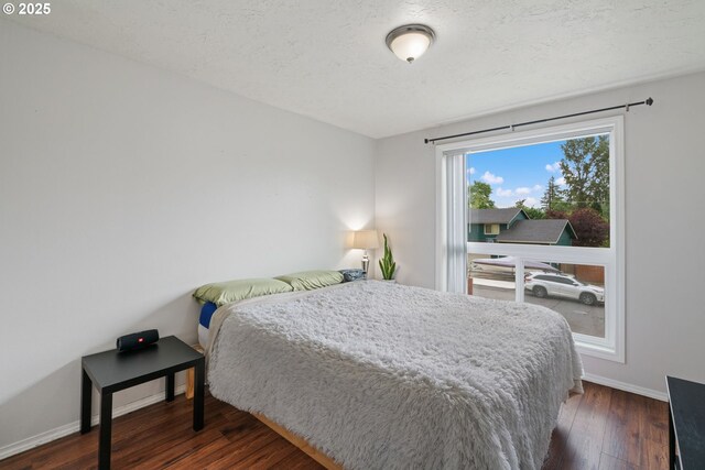 790 SE Robin Way, Gresham, OR 97080 - bedroom featuring wood finished floors and baseboards