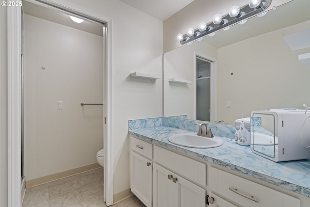 790 SE Robin Way, Gresham, OR 97080 - bathroom featuring vanity, toilet, baseboards, tile patterned flooring, and a shower with shower door
