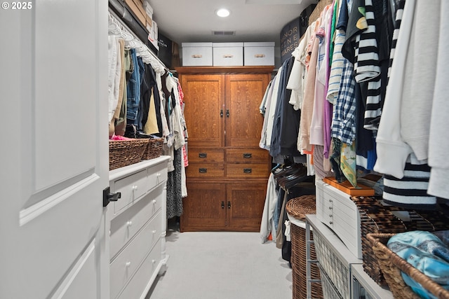 walk in closet with carpet floors and visible vents