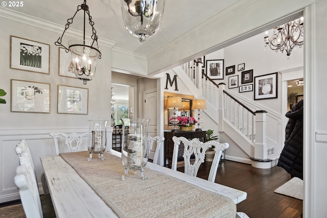 dining space with stairway, crown molding, a chandelier, and dark wood-type flooring