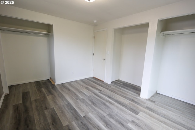 650 S Cammann St, Coos Bay, OR 97420 - unfurnished bedroom with wood finished floors and a closet