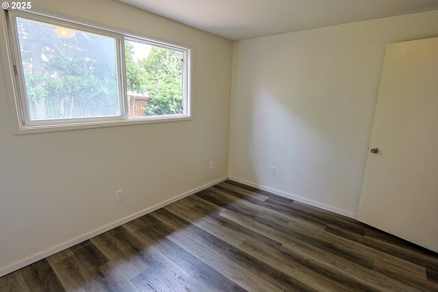 650 S Cammann St, Coos Bay, OR 97420 - spare room featuring dark wood finished floors and baseboards