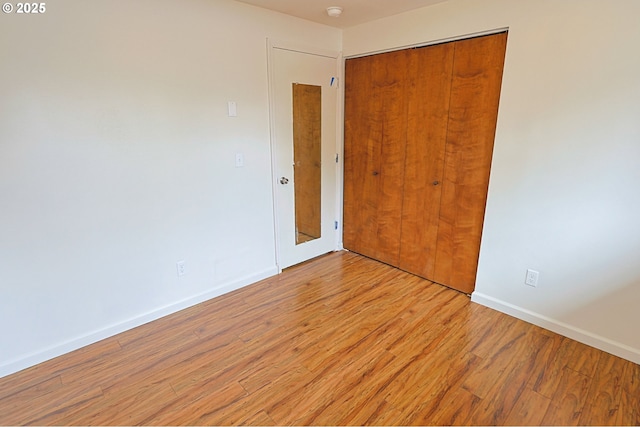 650 S Cammann St, Coos Bay, OR 97420 - empty room with light wood-type flooring and a smoke detector