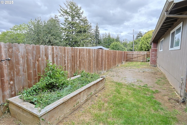 650 S Cammann St, Coos Bay, OR 97420 - fenced backyard with a vegetable garden