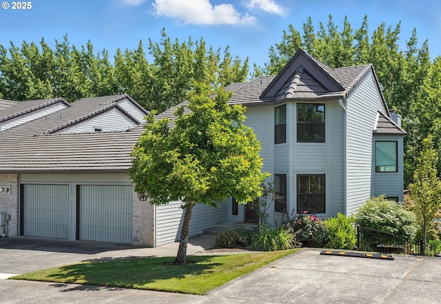 3300 NE 164th St Unit X1, Ridgefield, WA 98642 - view of front of house with brick siding and a tile roof