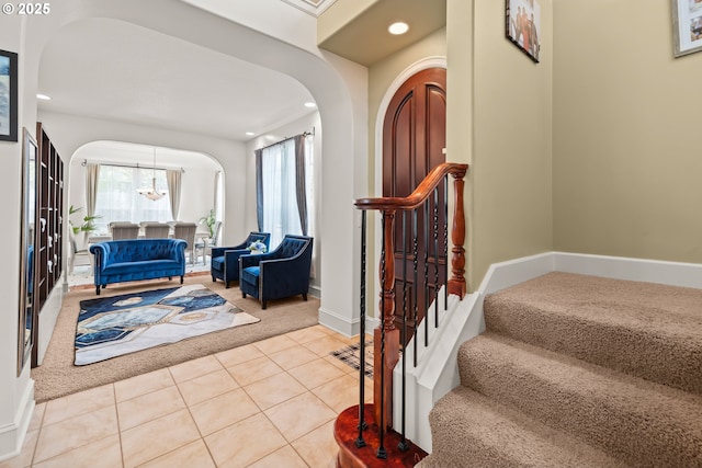 12696 NW Alsace Ln, Portland, OR 97229 - foyer featuring carpet floors, stairway, recessed lighting, tile patterned flooring, and arched walkways
