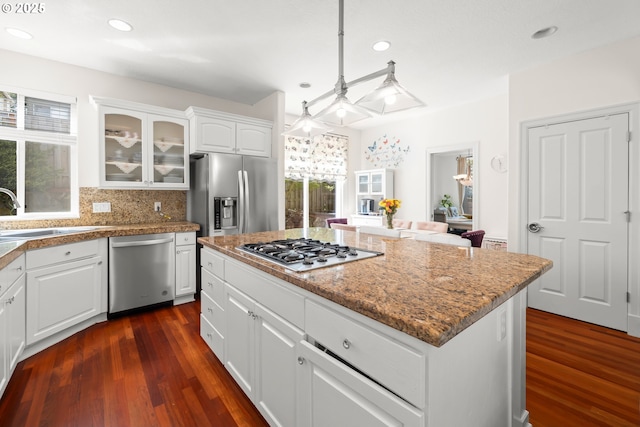 12696 NW Alsace Ln, Portland, OR 97229 - kitchen with appliances with stainless steel finishes, a sink, plenty of natural light, glass insert cabinets, and recessed lighting
