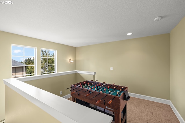 12696 NW Alsace Ln, Portland, OR 97229 - rec room featuring baseboards, carpet floors, a textured ceiling, and recessed lighting