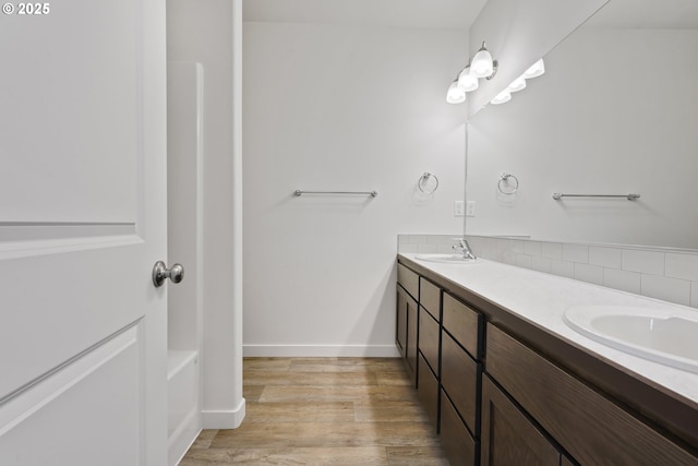469 N 35th, Springfield, OR 97478 - full bath with double vanity, wood finished floors, decorative backsplash, and baseboards