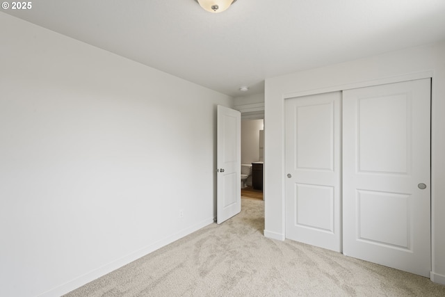 469 N 35th, Springfield, OR 97478 - unfurnished bedroom featuring light colored carpet, baseboards, and a closet