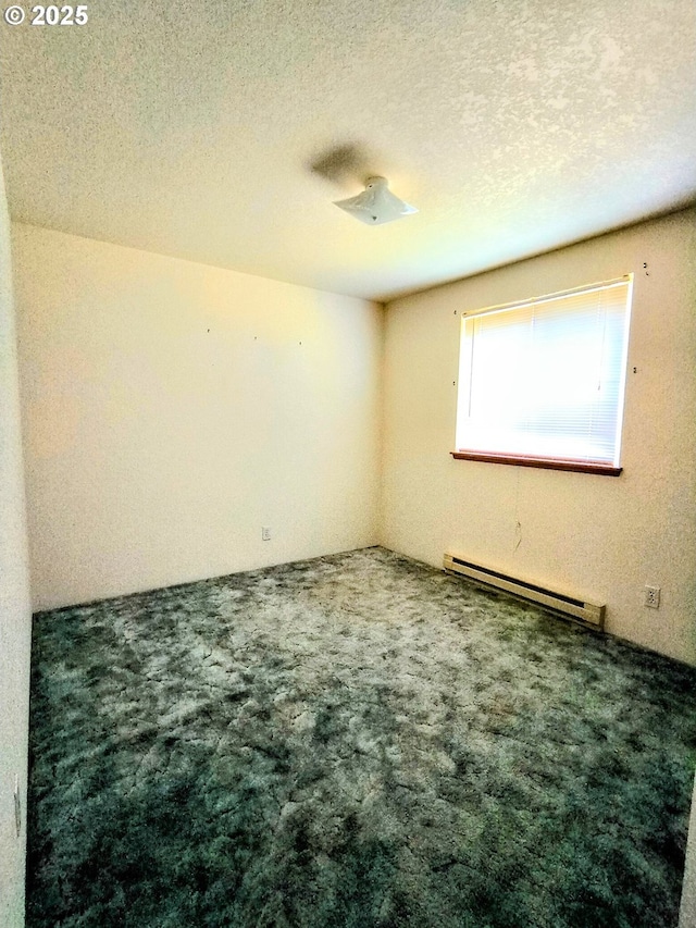 444 Char St, Roseburg, OR 97471 - spare room with a baseboard radiator, carpet, and a textured ceiling