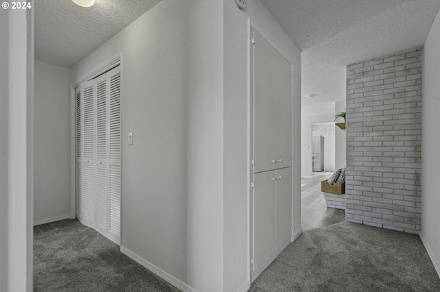 5323 Verda Ln, Keizer, OR 97303 - corridor with a textured ceiling, carpet floors, and baseboards