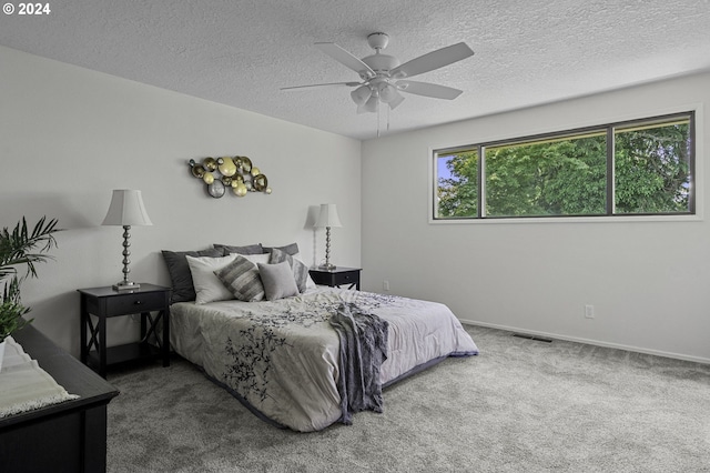 5323 Verda Ln, Keizer, OR 97303 - carpeted bedroom with a textured ceiling, baseboards, and ceiling fan