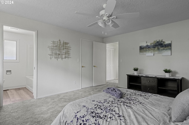 5323 Verda Ln, Keizer, OR 97303 - carpeted bedroom featuring a textured ceiling, baseboards, a ceiling fan, and ensuite bath