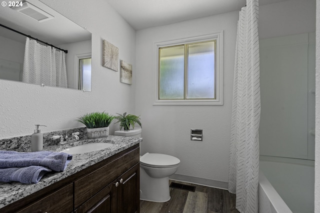 5323 Verda Ln, Keizer, OR 97303 - bathroom featuring vanity, wood finished floors, toilet, baseboards, and shower / tub combo with curtain