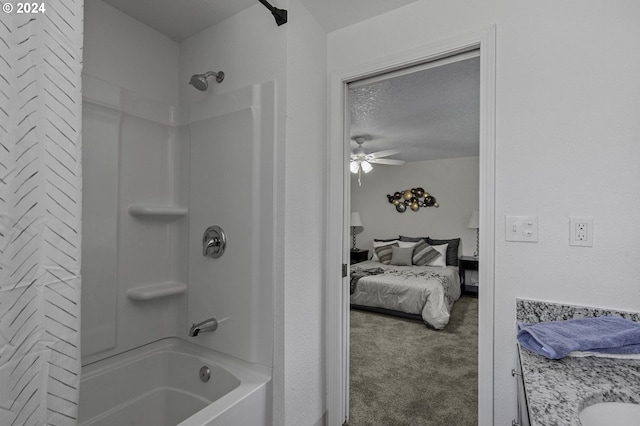 5323 Verda Ln, Keizer, OR 97303 - ensuite bathroom featuring bathing tub / shower combination, vanity, a ceiling fan, and a textured ceiling