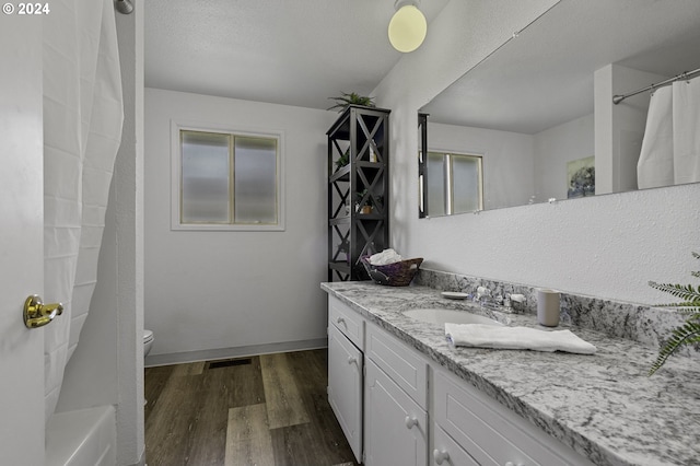 5323 Verda Ln, Keizer, OR 97303 - full bath featuring vanity, wood finished floors, toilet, and baseboards