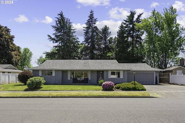 5323 Verda Ln, Keizer, OR 97303 - single story home with concrete driveway, a garage, and board and batten siding