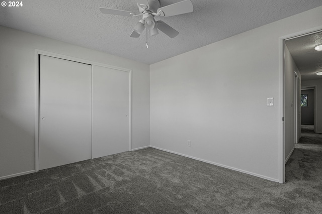 5323 Verda Ln, Keizer, OR 97303 - unfurnished bedroom featuring carpet, a textured ceiling, a closet, a ceiling fan, and baseboards