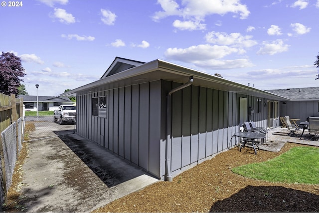5323 Verda Ln, Keizer, OR 97303 - view of side of home with board and batten siding and a patio area