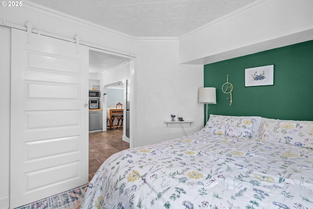 bedroom featuring an ornate ceiling and crown molding