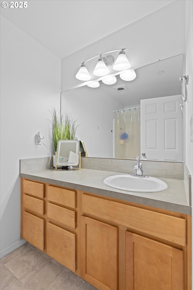 full bathroom with curtained shower and vanity