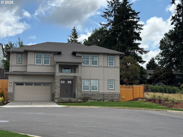 13998 SW 165th Ave, Tigard, OR 97223 - view of front of home with stone siding, stucco siding, driveway, and an attached garage