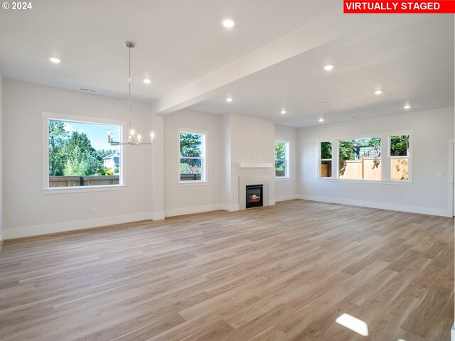 13998 SW 165th Ave, Tigard, OR 97223 - unfurnished living room featuring recessed lighting, baseboards, and light wood-style flooring