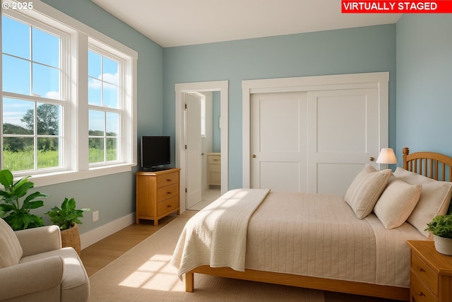 13998 SW 165th Ave, Tigard, OR 97223 - bedroom with light wood-style floors and a closet