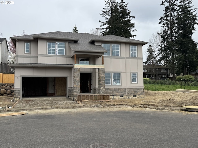 13998 SW 165th Ave, Tigard, OR 97223 - view of front of home with stone siding, stucco siding, roof with shingles, and an attached garage