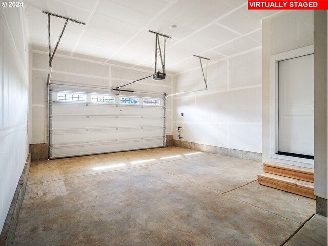 13998 SW 165th Ave, Tigard, OR 97223 - garage featuring a garage door opener