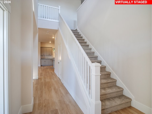 13998 SW 165th Ave, Tigard, OR 97223 - stairway featuring wood finished floors and baseboards